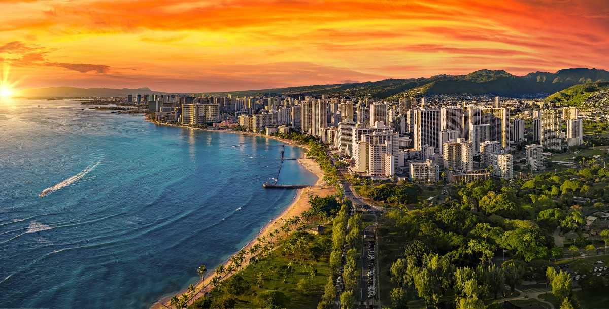 Waikīkī Beach with the hotel skyline and Diamond Head beyond it